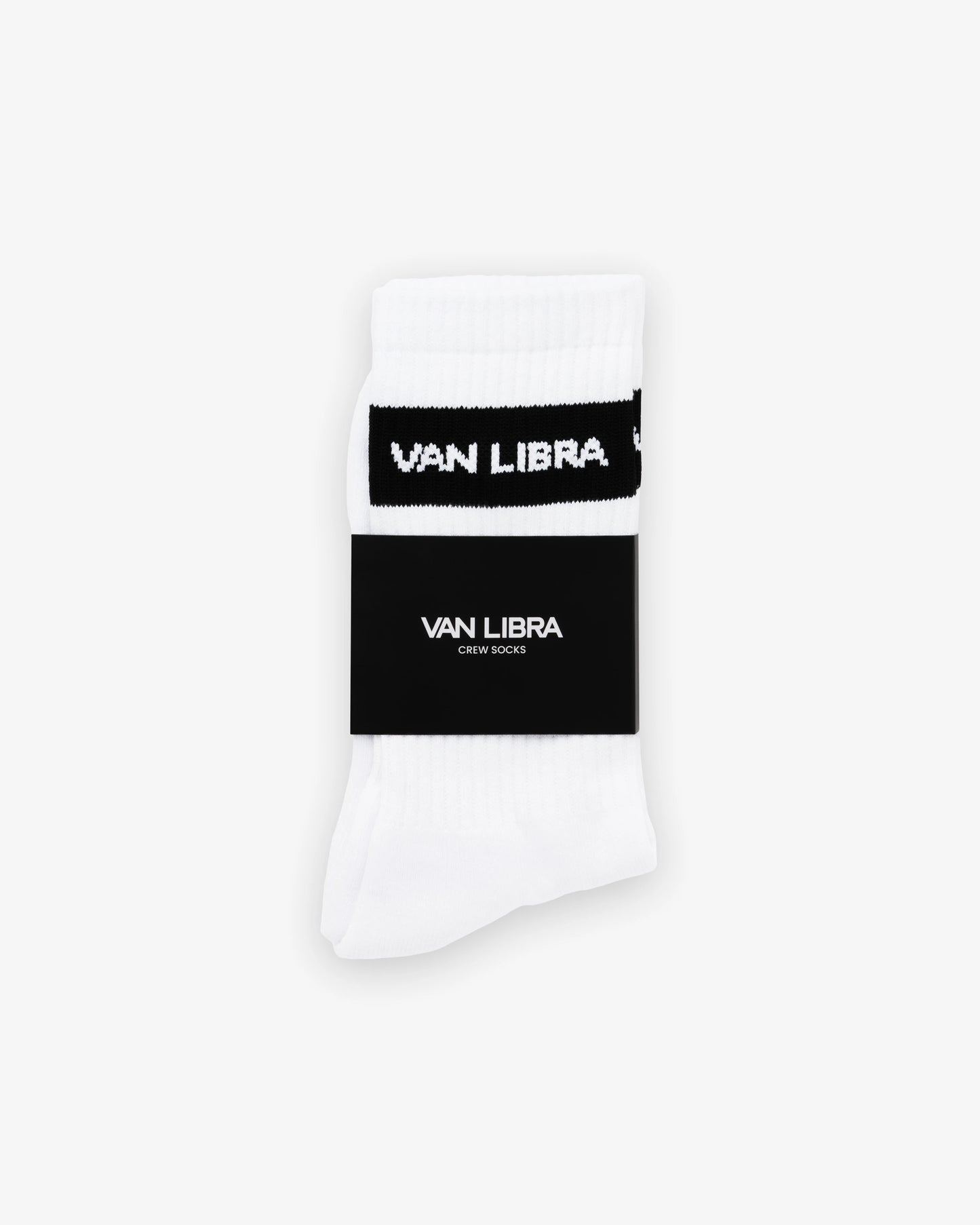 Van Libra Classic Logo crew socks in white with a black jacquard band around the cuff featuring “VAN LIBRA” text. Additional “VAN LIBRA” branding is jacquard knit on the foot.