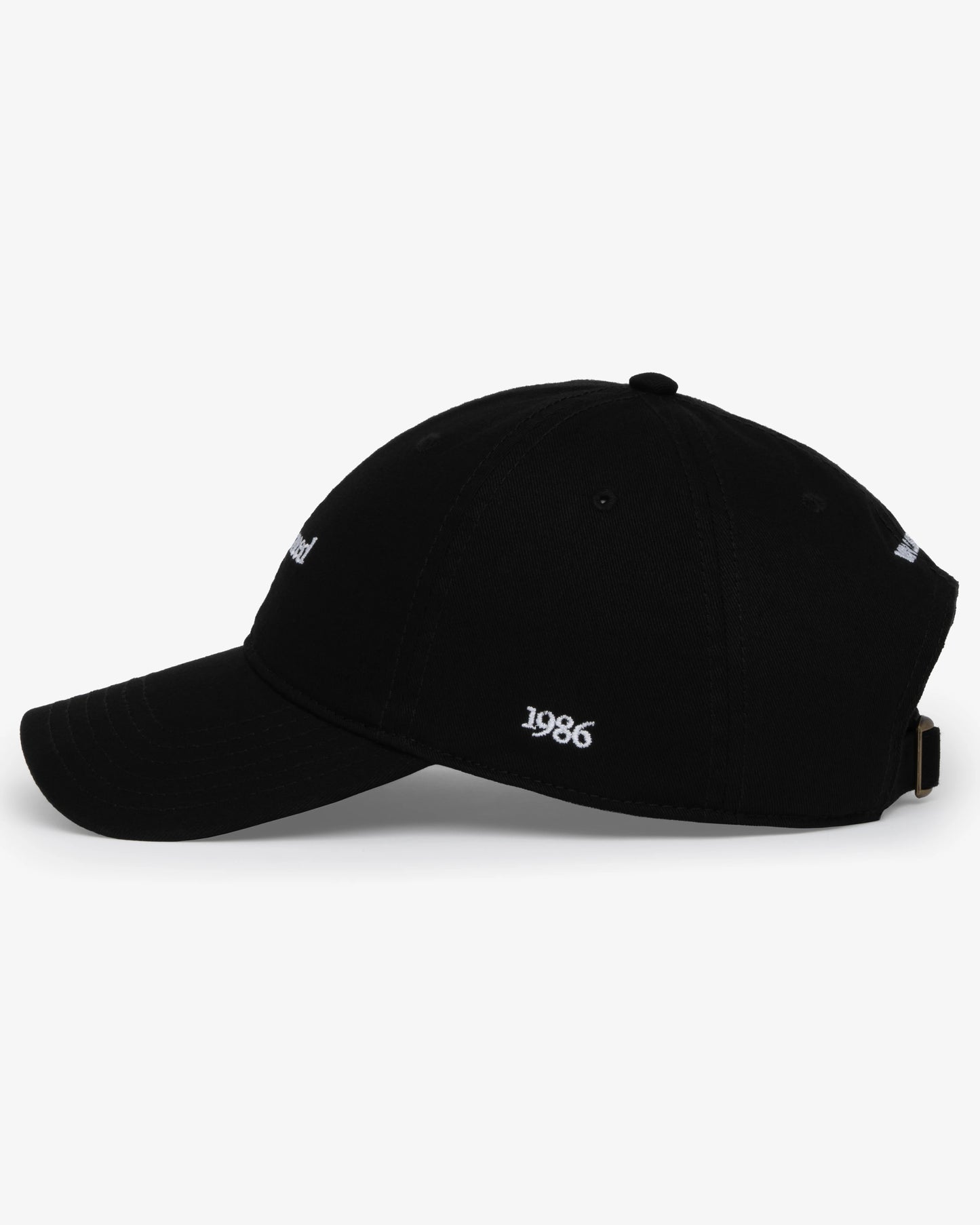 Van Libra Blackwood (black) dad hat with white embroidered text “Stay Balanced” on the front, “1986” stitched on the side, and “VAN LIBRA” on the back above an adjustable strap with brass buckle.