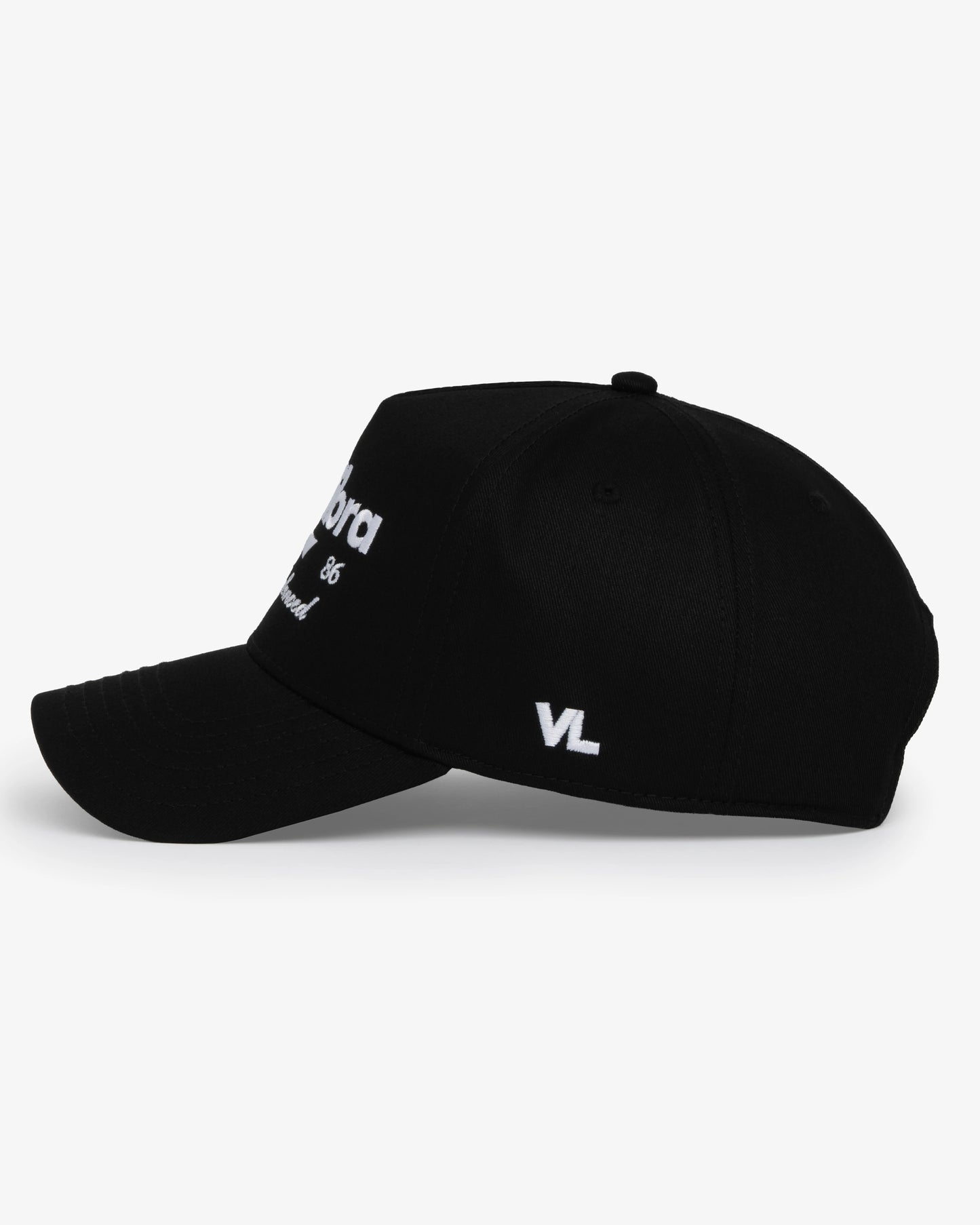 Van Libra Blackwood (black) structured cap with blackwood colored crown and brim. Features white embroidered text “van libra” with abstract triangle graphic on the front, “1986” and “Stay Balanced” lettering on the front, plus “VL” stitched on the side, finished with an adjustable blackwood snapback closure at the back.