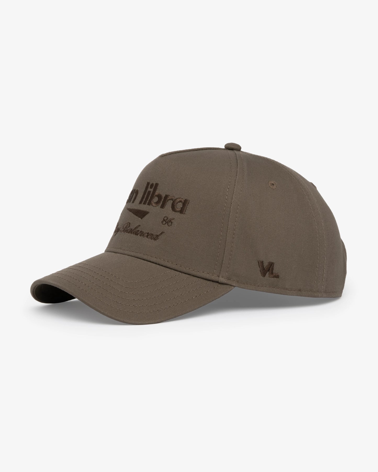 Van Libra Umber (brown) structured cap with umber colored crown and brim. Features brown embroidered text “van libra” with abstract triangle graphic on the front, “1986” and “Stay Balanced” lettering on the front, plus “VL” stitched on the side, finished with an adjustable umber snapback closure at the back.