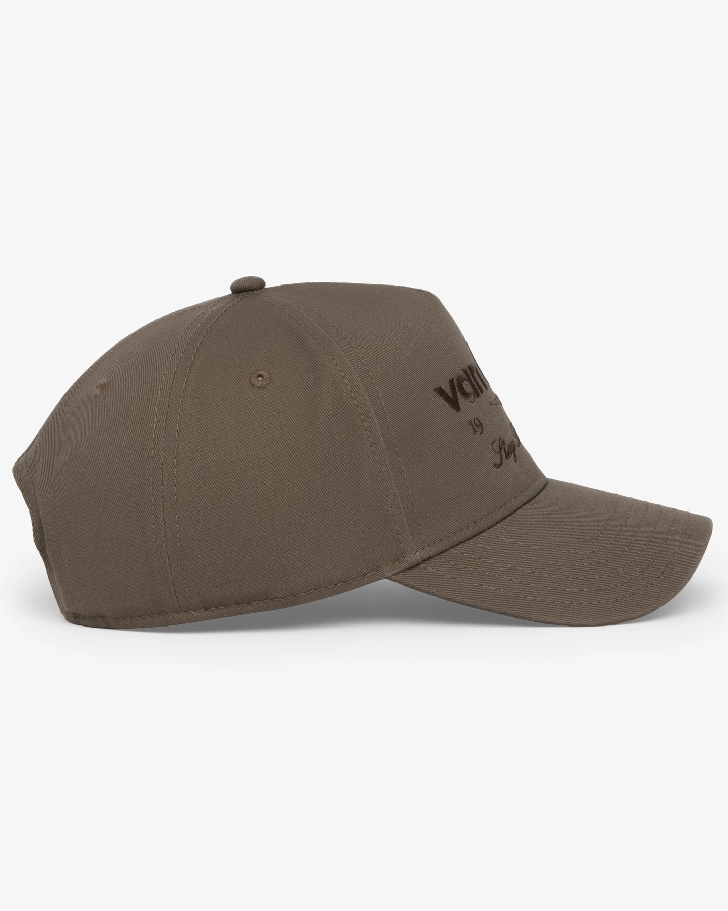 Van Libra Umber (brown) structured cap with umber colored crown and brim. Features brown embroidered text “van libra” with abstract triangle graphic on the front, “1986” and “Stay Balanced” lettering on the front, plus “VL” stitched on the side, finished with an adjustable umber snapback closure at the back.