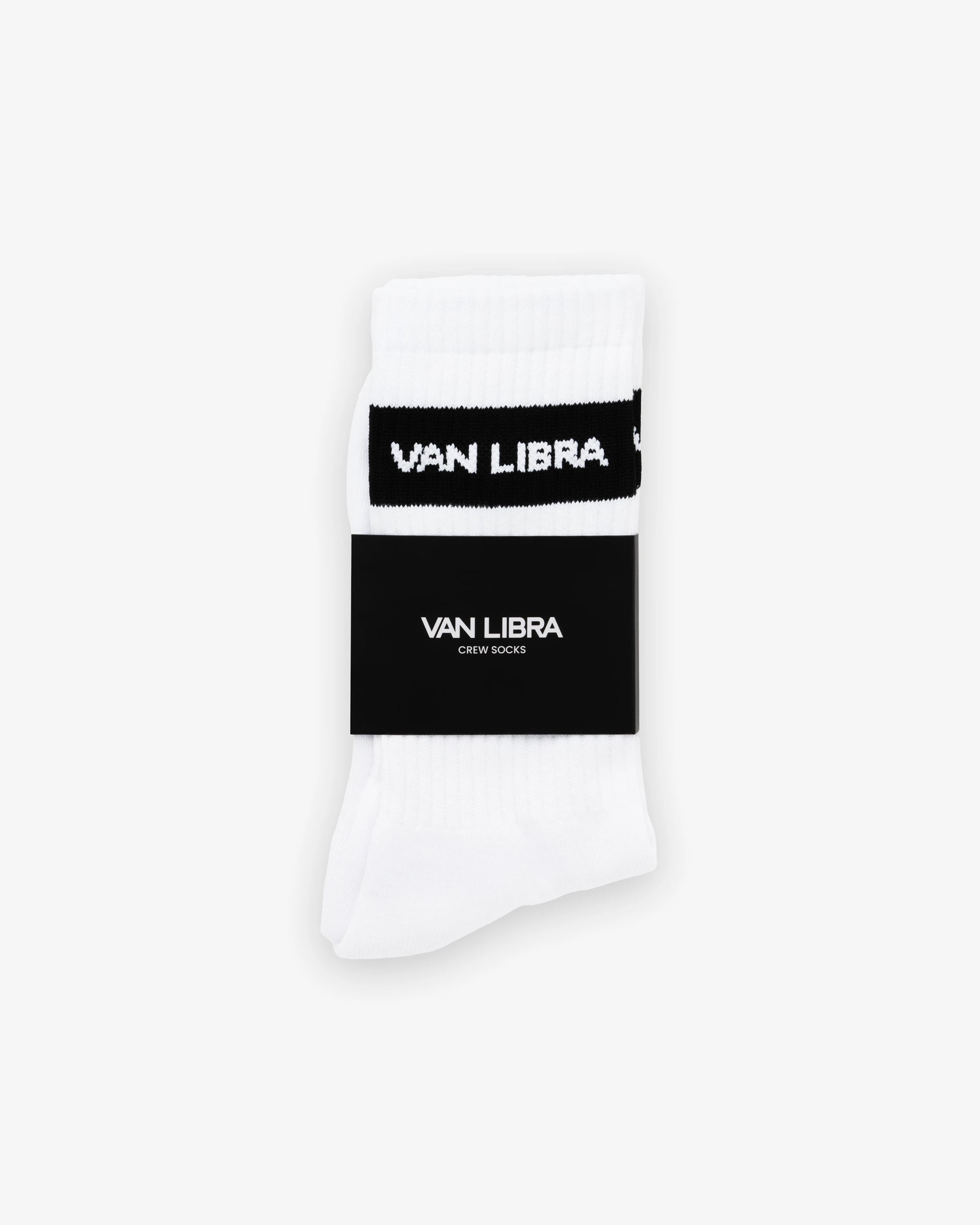 Van Libra Classic Logo crew socks in white with a black jacquard band around the cuff featuring “VAN LIBRA” text. Additional “VAN LIBRA” branding is jacquard knit on the foot.
