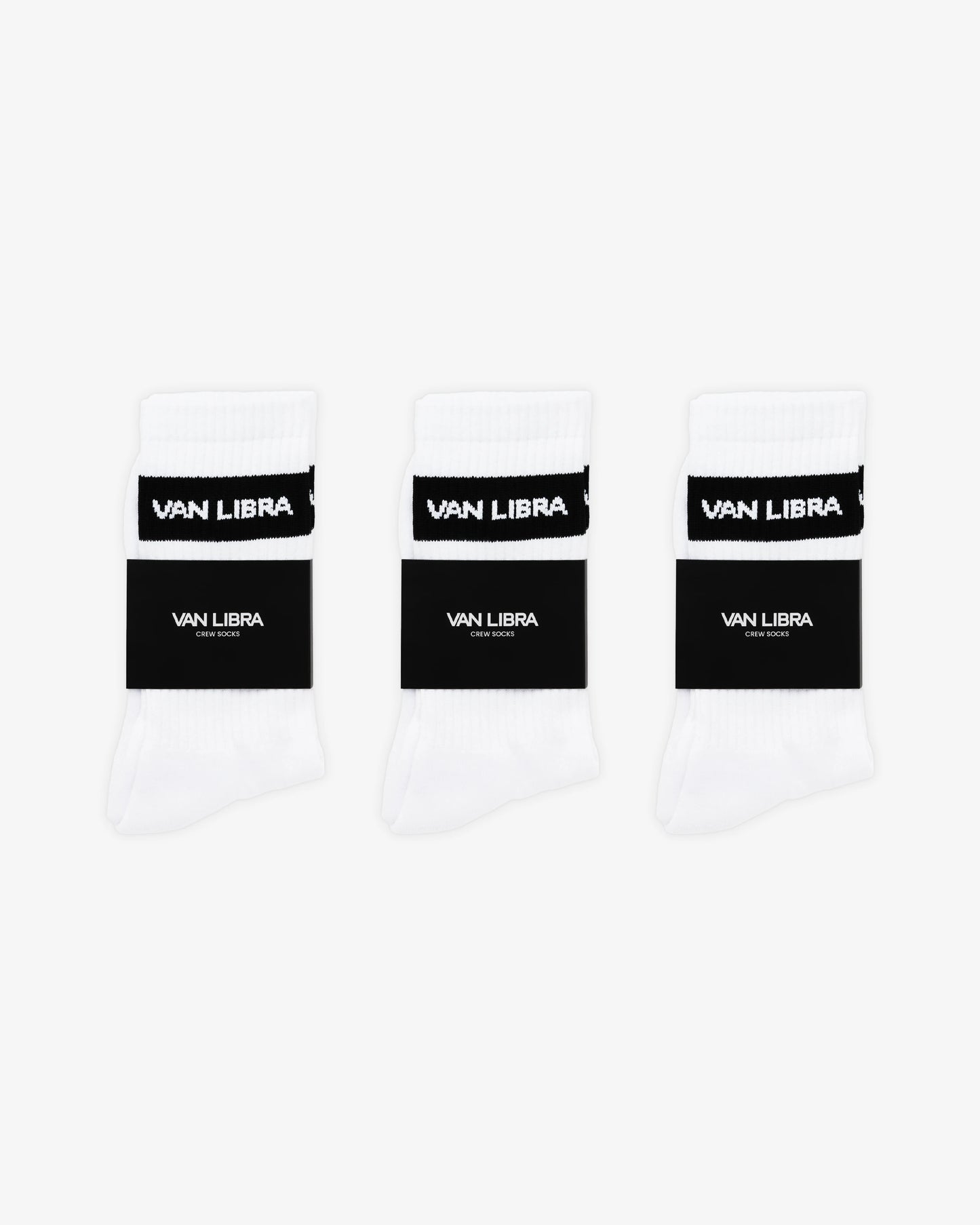Van Libra Classic Logo crew socks in white with a black jacquard band around the cuff featuring “VAN LIBRA” text. Additional “VAN LIBRA” branding is jacquard knit on the foot.
