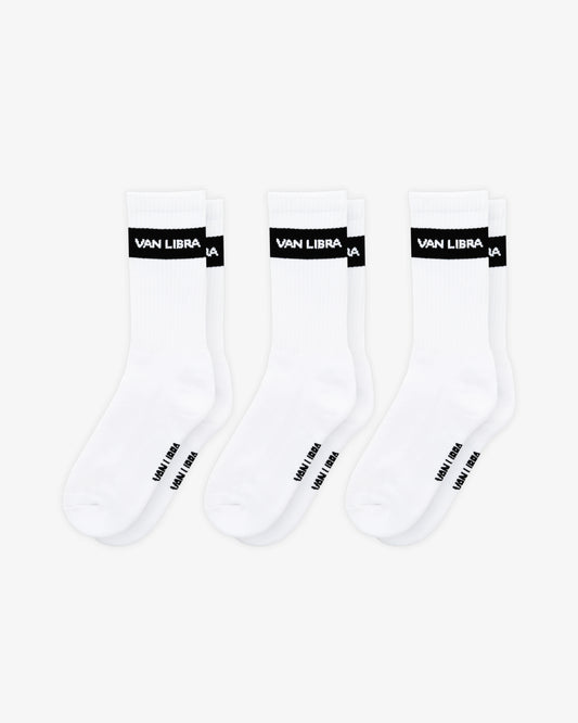 Van Libra Classic Logo crew socks in white with a black jacquard band around the cuff featuring “VAN LIBRA” text. Additional “VAN LIBRA” branding is jacquard knit on the foot.