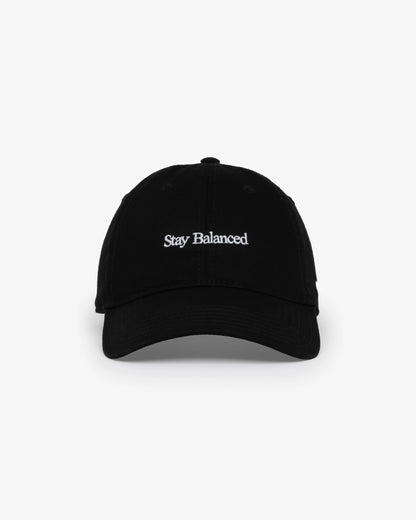 Van Libra Blackwood (black) dad hat with white embroidered text “Stay Balanced” on the front, “1986” stitched on the side, and “VAN LIBRA” on the back above an adjustable strap with brass buckle.