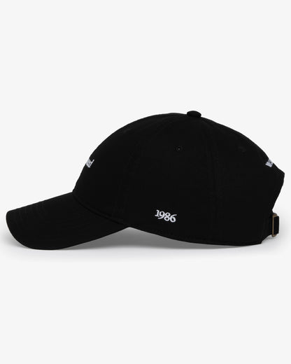 Van Libra Blackwood (black) dad hat with white embroidered text “Stay Balanced” on the front, “1986” stitched on the side, and “VAN LIBRA” on the back above an adjustable strap with brass buckle.