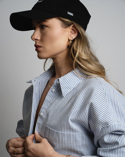 Van Libra Blackwood (black) dad hat with white embroidered text “Stay Balanced” on the front, “1986” stitched on the side, and “VAN LIBRA” on the back above an adjustable strap with brass buckle.