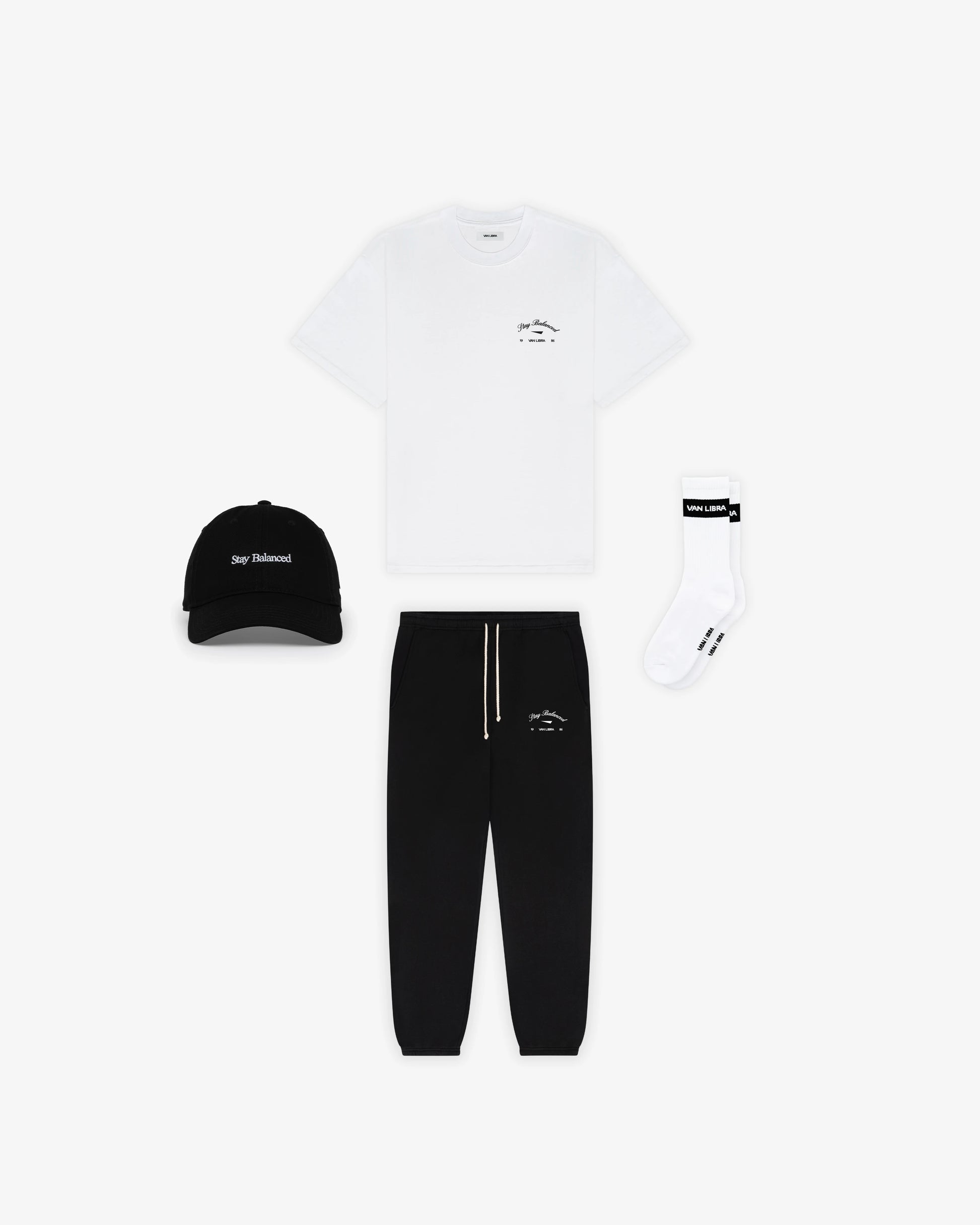 Van Libra Blackwood (black) dad hat with white embroidered text “Stay Balanced” on the front, “1986” stitched on the side, and “VAN LIBRA” on the back above an adjustable strap with brass buckle.