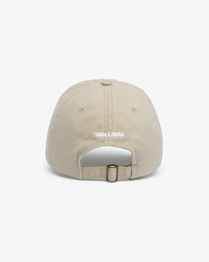 Van Libra Dune (beige) dad hat with white embroidered text “Stay Balanced” on the front, “1986” stitched on the side, and “VAN LIBRA” on the back above an adjustable strap with brass buckle.