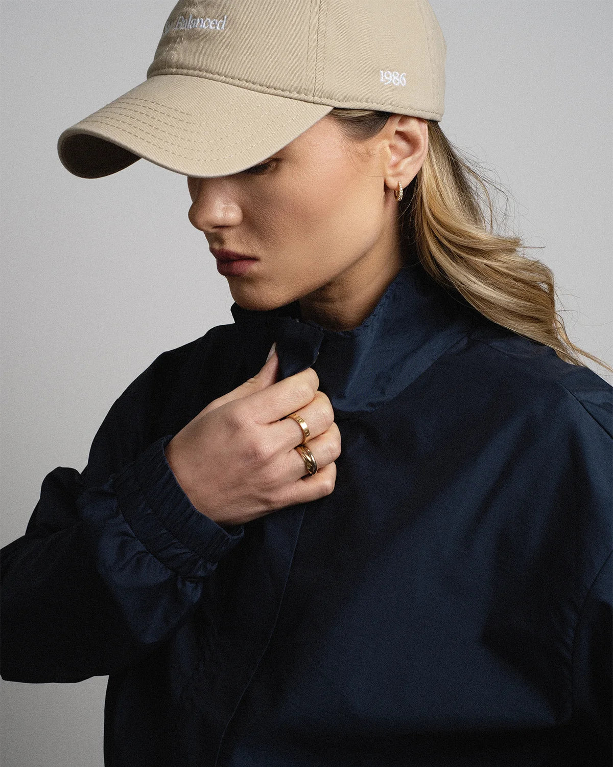 Van Libra Dune (beige) dad hat with white embroidered text “Stay Balanced” on the front, “1986” stitched on the side, and “VAN LIBRA” on the back above an adjustable strap with brass buckle.