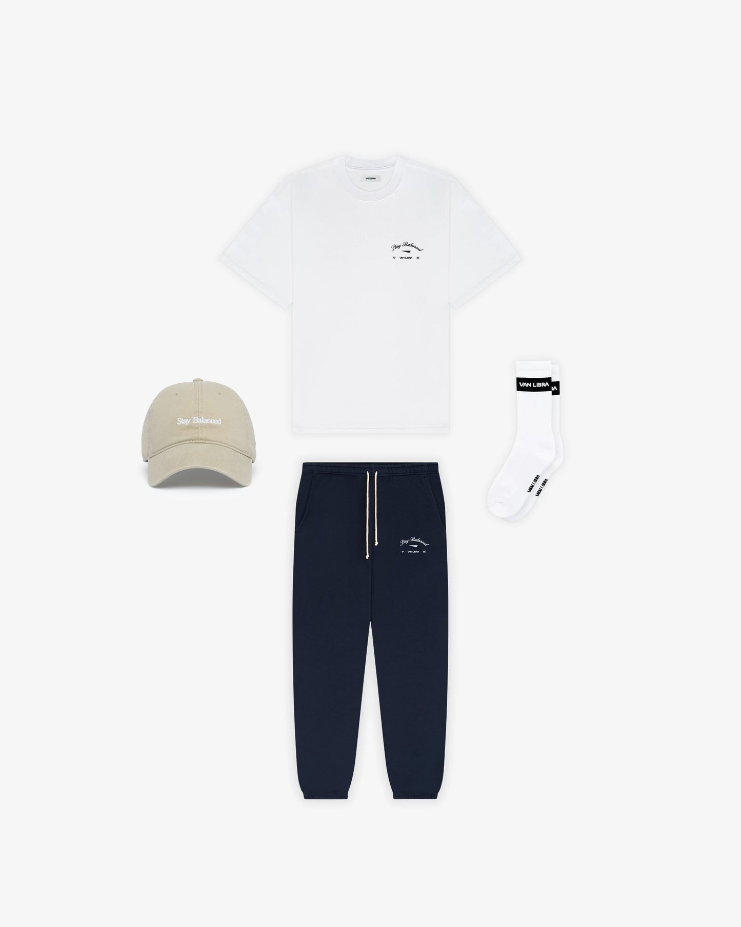 Van Libra Dune (beige) dad hat with white embroidered text “Stay Balanced” on the front, “1986” stitched on the side, and “VAN LIBRA” on the back above an adjustable strap with brass buckle.