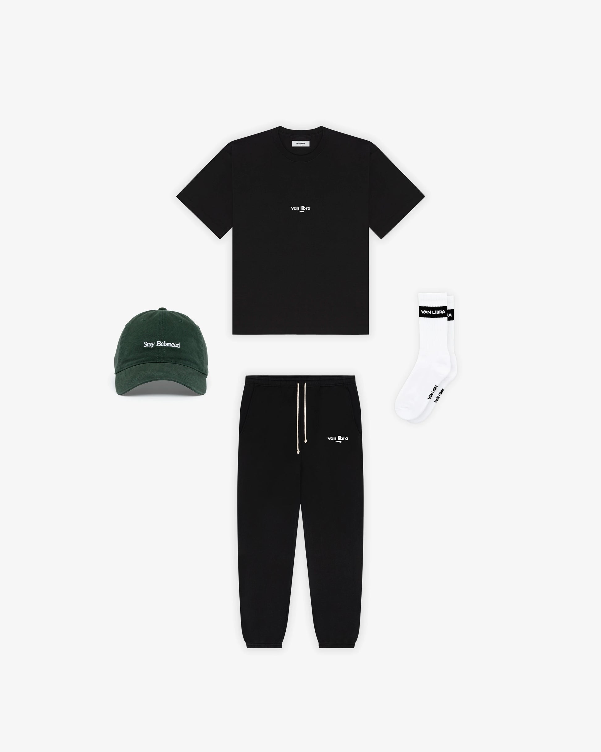 Van Libra Forest (dark green) dad hat with white embroidered text “Stay Balanced” on the front, “1986” stitched on the side, and “VAN LIBRA” on the back above an adjustable strap with brass buckle.