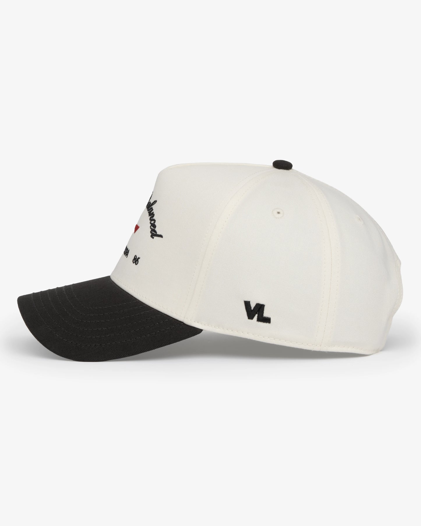 Van Libra Bone/Carbon (cream and dark gray) structured cap with bone colored crown and carbon colored brim. Features black embroidered text “Stay Balanced” with red abstract triangle graphic on the front, black “1986” and “VAN LIBRA” details, and “VL” stitched on the side, finished with an adjustable carbon colored snapback closure at the back.