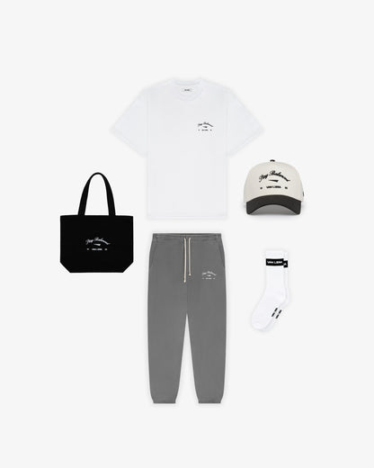 Van Libra Blackwood (black) canvas tote bag with white embroidery. Features “Stay Balanced” text above an abstract triangle graphic, with “VAN LIBRA” and the numbers “19” and “86” stitched below.